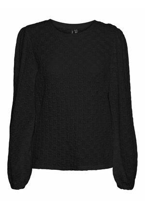 Must mustriga pluus, mis on valmistatud tekstuuriga kangast, ümmarguse kaelusega ja kergelt puffetsevate varrukatega. Pluus on lõdva lõikega ja sellel on peen muster.