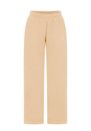 Pantalon beige à jambes larges avec taille élastique, fabriqué en tissu doux, présentant un logo brodé ton sur ton discret sur le devant.