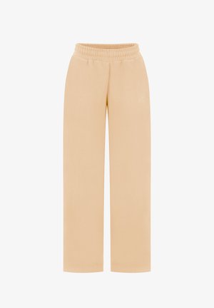 Pantalon beige à jambes larges avec taille élastique, fabriqué en tissu doux, présentant un logo brodé ton sur ton discret sur le devant.