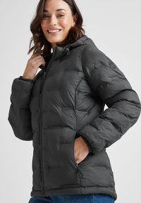 Black puffer jacket with a zip front, elastic cuffs, and a hood. Features a subtle textured pattern and side pockets.