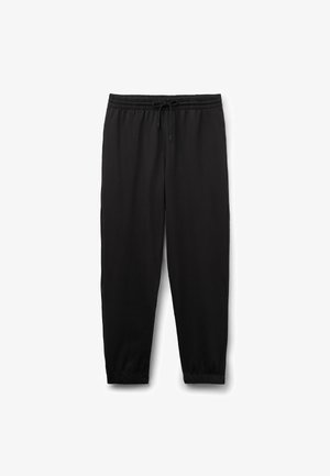 Černé sportovní kalhoty s elastickým pasem a nastavitelnou šňůrkou, zúženými nohavicemi a elastickými manžetami na kotnících.