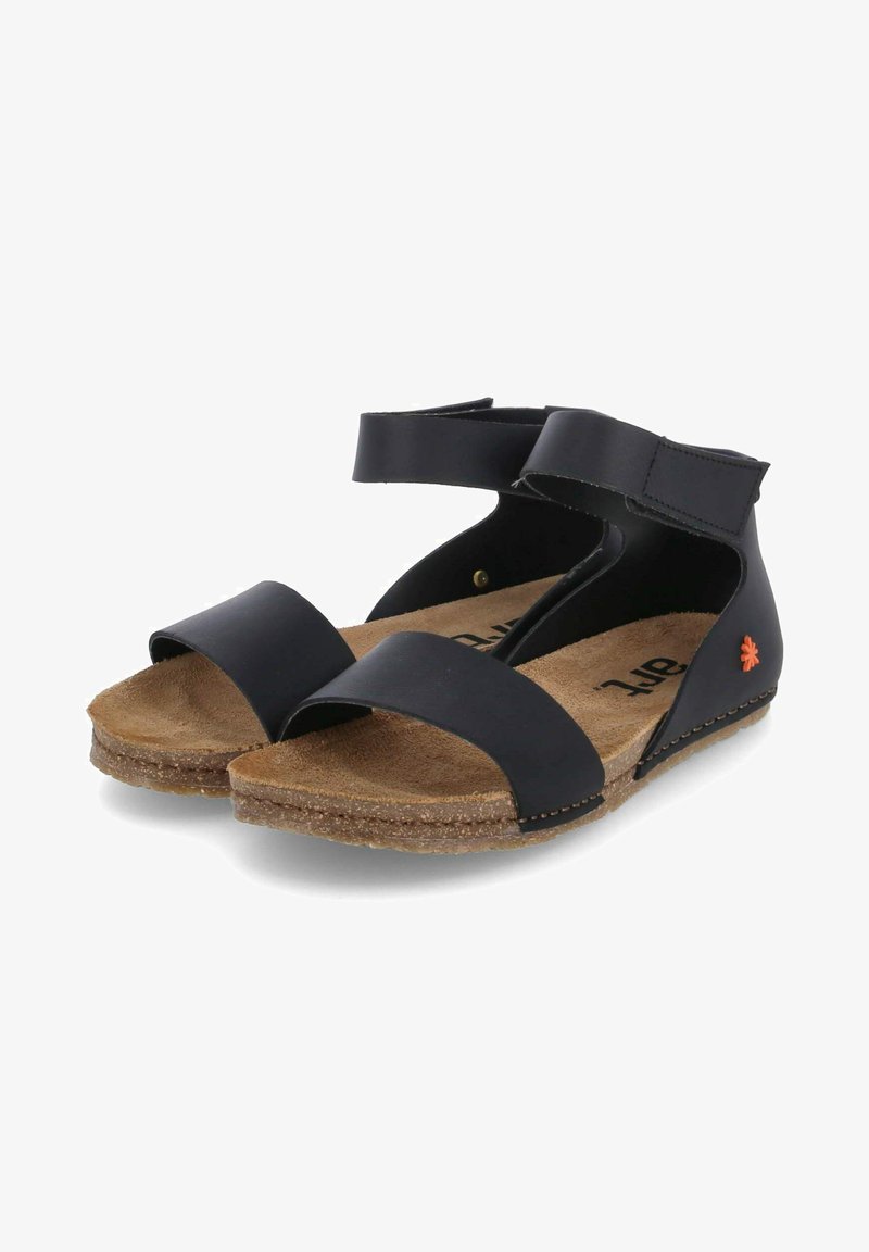 Schwarze Ledersandalen mit breiten Riemen, einem Knö Verschluss und einer strukturierten Korksohle. Auffälliger oranger Akzent an der Seite.