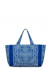 Niebieska torba materiałowa z wzorem paisley w białym kolorze. Posiada dwa uchwyty oraz dużą, otwartą komorę główną. Teksturowane wykończenie.