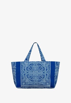Niebieska torba materiałowa z wzorem paisley w białym kolorze. Posiada dwa uchwyty oraz dużą, otwartą komorę główną. Teksturowane wykończenie.