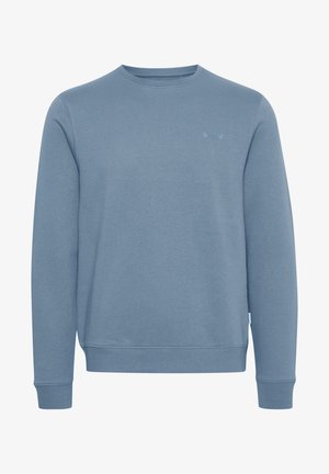 Sudadera azul hecha de un tejido suave y texturizado. Diseño de cuello redondo, mangas largas y puños acanalados. Detalle de logo sutil en la parte frontal.