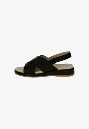 Sandal in pelle nera con cinturini incrociati, punta aperta e cinturino alla caviglia regolabile. Presenta una soletta color beige chiaro e una suola bassa.