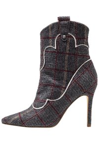 Gray plaid ankle boot with pointed toe, high stiletto heel, contrasting white trim, and decorative scalloped edges. Textured wool material.