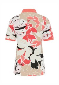 Polo-Shirt mit floralem Muster und kurzen Ärmeln. Verfügt über Beigetöne, Rosa, Rot und Schwarz. Einfarbiger Korallkragen und Akzentbesätze.