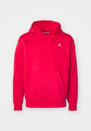 Rød hoodie lavet af blødt stof, med en kængurulomme og et lille hvidt logo på brystet. Ribbede manchetter og kant.