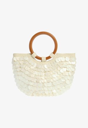 Beežist kangast käekott suurte ümmarguste puidust käepidemetega, kaetud kattuvate valgete värvimuutlike litritega.