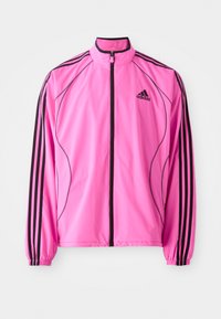 Pink windbreaker jacket with black accents, features a high collar, front zipper, and three black stripes on each sleeve.