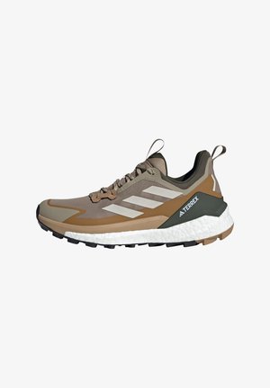 Brown and olive green trail shoe with mesh upper, white cushioning midsole, black outsole, and three white stripes on the side.