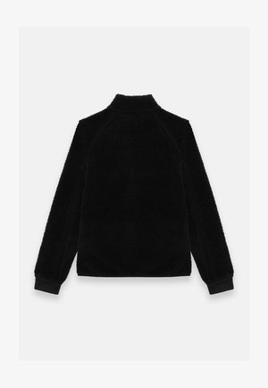 Melna vilnas jaka ar augstu apkakli un garām piedurknēm. Mīksta tekstūra, minimāls dizains, ar melnu apdari gar šuvēm. Redzams tikai aizmugures skats.