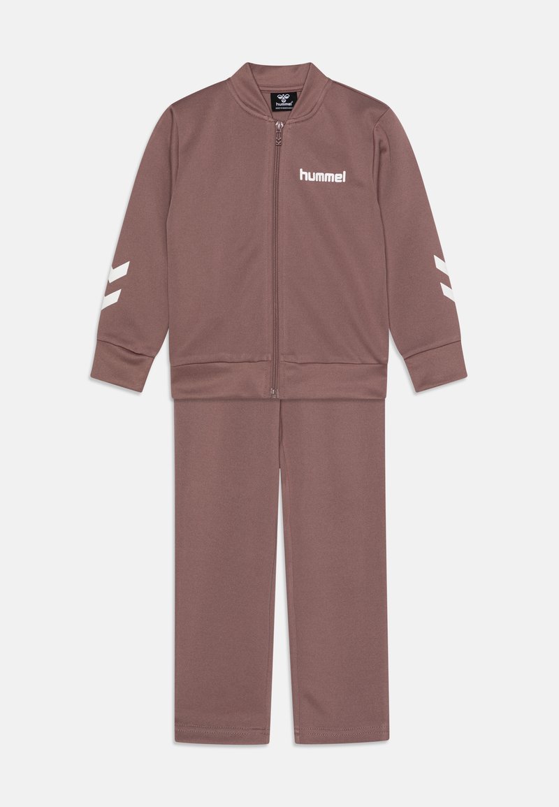 Brown athletic tracksuit made of smooth fabric, featuring a zip-up jacket with white logo and stripes, and matching pants with elastic cuffs.