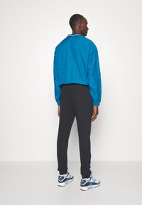 Nike Performance ATLETICO MADRID PANT THIRD - Joukkuetuote - black/oil green