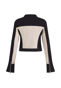 Sort og beige langærmet cropped jakke med frontlynlåse på manchetterne, farveblokdesign og høj krave, vist fra ryggen.