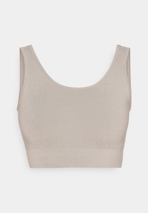 Top bez rukávů v jemné béžové barvě, vyrobený z elastického materiálu. Obsahuje výstřih ve tvaru lodičky a široké ramínka pro větší pohodlí. Hladký povrch po celé délce.