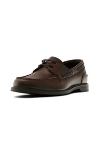 Brown leather boat shoe with a rounded toe, subtle stitching details, and a low black rubber sole, featuring a lace-up front design.