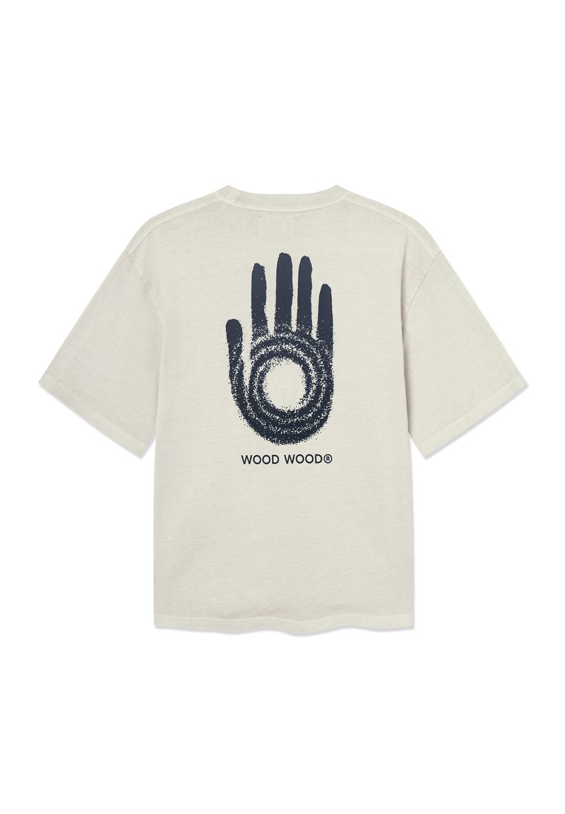 T-shirt en coton beige clair avec un graphique de main marine et un design circulaire au dos. Il est doté d'un col rond et de manches courtes.