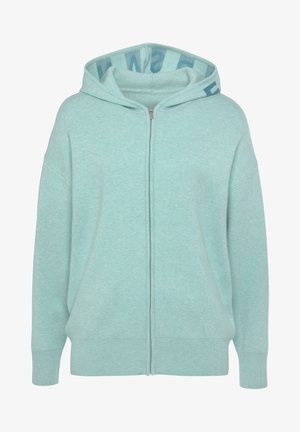 Hellgrüne Zip-Hoodie aus weichem Stoff. Verfügt über eine Kapuze mit Kordelzug, gerippte Bündchen und ein kontrastierendes Muster im Inneren der Kapuze.