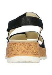 Zwarte leren sandaal met een gestructureerde kurken loopzool en witte profiel. Voorzien van verstelbare banden voor een veilige pasvorm.