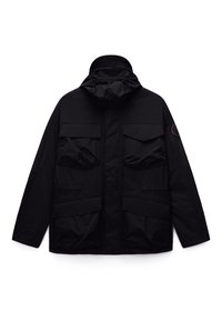 Black hooded jacket with four front flap pockets and a circular patch on the left sleeve, designed for outdoor use.