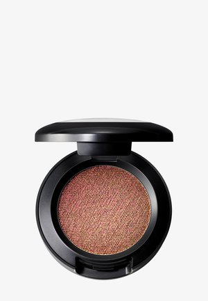 Compact rond noir contenant un blush scintillant avec une surface texturée rose et or, arborant un couvercle noir lisse.