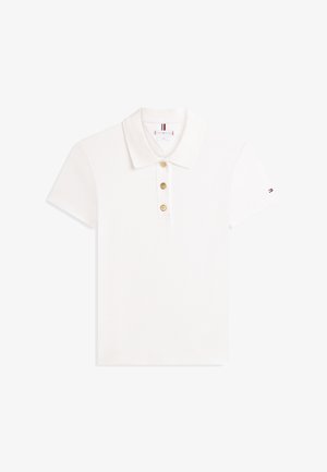 Valkoinen puuvillainen poolopaita, jossa on tasainen kaulus, kolme kultanappia ja lyhyet hihat. Pieni logoyksityiskohta yhdessä hihassa.