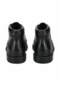 Botas de tobillo de cuero negro con una textura suave, punta redondeada, detalles de costura sutiles y una suela de goma baja y duradera.