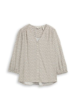 Blouse beige à manches longues avec motif géométrique noir subtil, manches légèrement froncées et encolure en V avec un petit pli à l'avant.