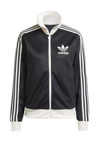 Černá sportovní bunda Adidas s bílými třemi pruhy na ramenech, vysokým límcem, zapínáním na zip a logem na levé straně hrudi.