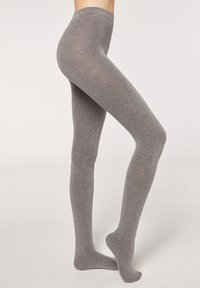 Grijze panty’s gemaakt van zacht, rekbaar materiaal; aansluitend ontwerp, naadloze constructie en een gladde textuur tot aan de enkel.