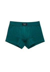 Boxers en coton bleu foncé avec un design ajusté, comportant une ceinture de marque et une pochette avant profilée. Texture lisse sur toute la surface.
