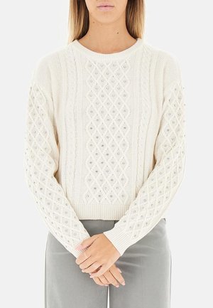 Maglione lavorato a maglia color crema con motivo a diamante e perline decorative, scollatura e polsini a coste, maniche lunghe.
