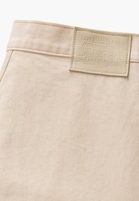 Levi's® MOJ PLEATED TROUSER - Trousers - soft ecru