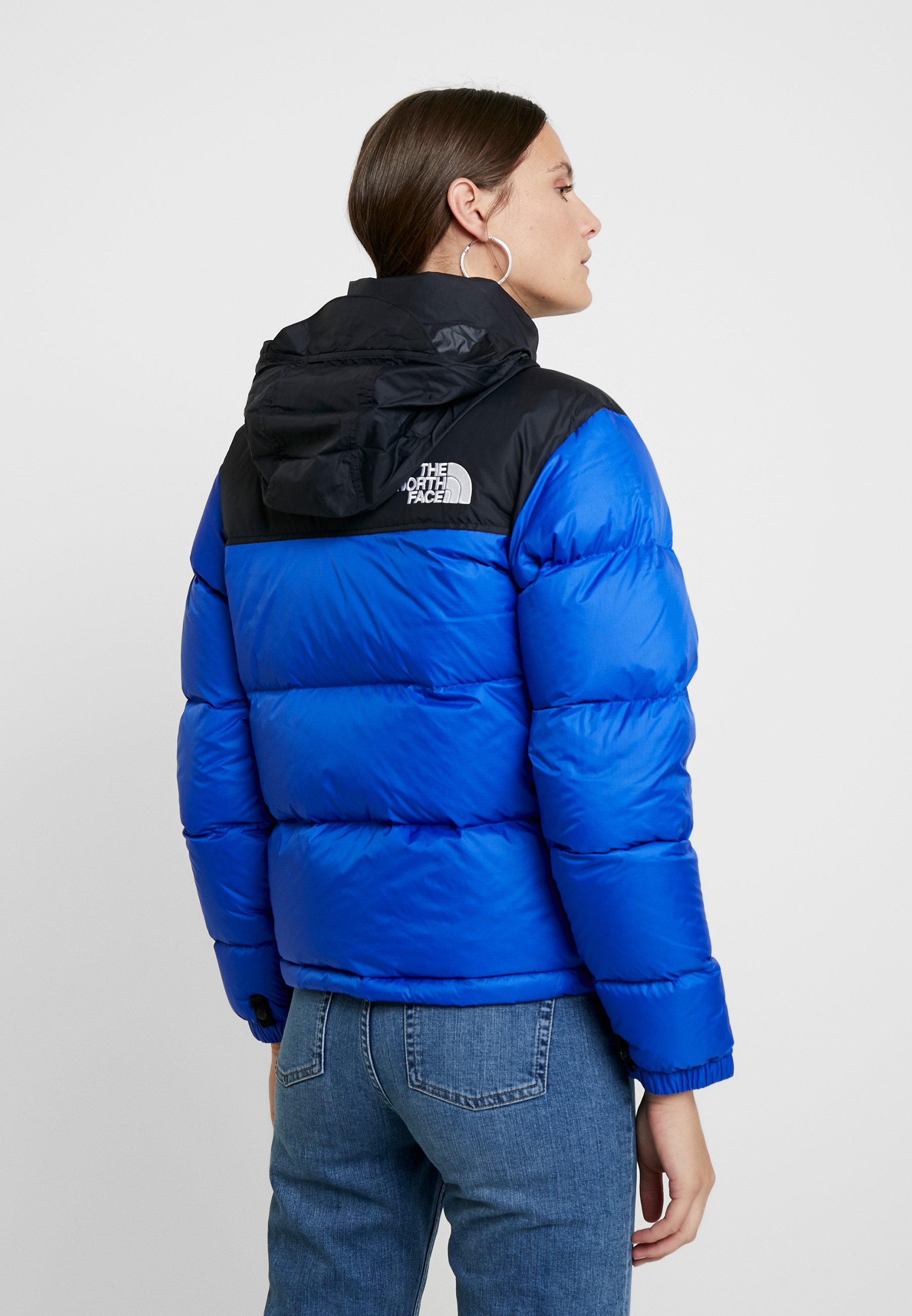 dark blue north face puffer jacket