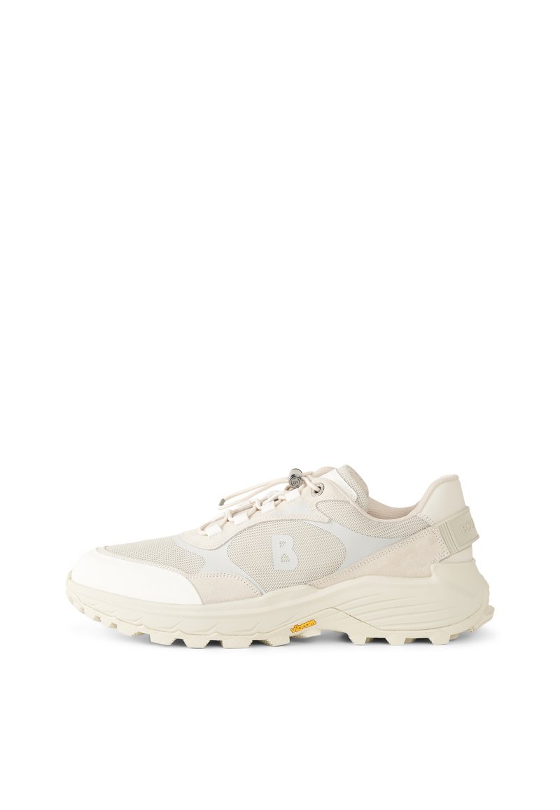 Beige sneakers with mesh and suede materials, featuring a padded collar, lacing system, and textured rubber sole with a distinctive logo.