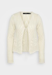 Krämfärgad stickad cardigan med V-ringning, långa ärmar, öppen fram och intrikata spetsmönster genom hela plagget. Har en knytning i midjan.
