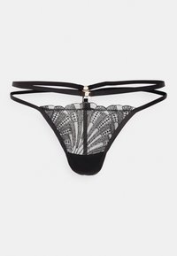 Tanga de renda preta com padrões florais intricados, apresentando alças ajustáveis e um pequeno destaque em metal dourado na parte de trás. Tecido suave.