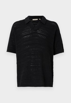 Svart kortermet polo-skjorte med en teksturert, åpen strikkedesign. Har V-hals og et mykt, vevd stoff. Minimalistisk og pustende stil.