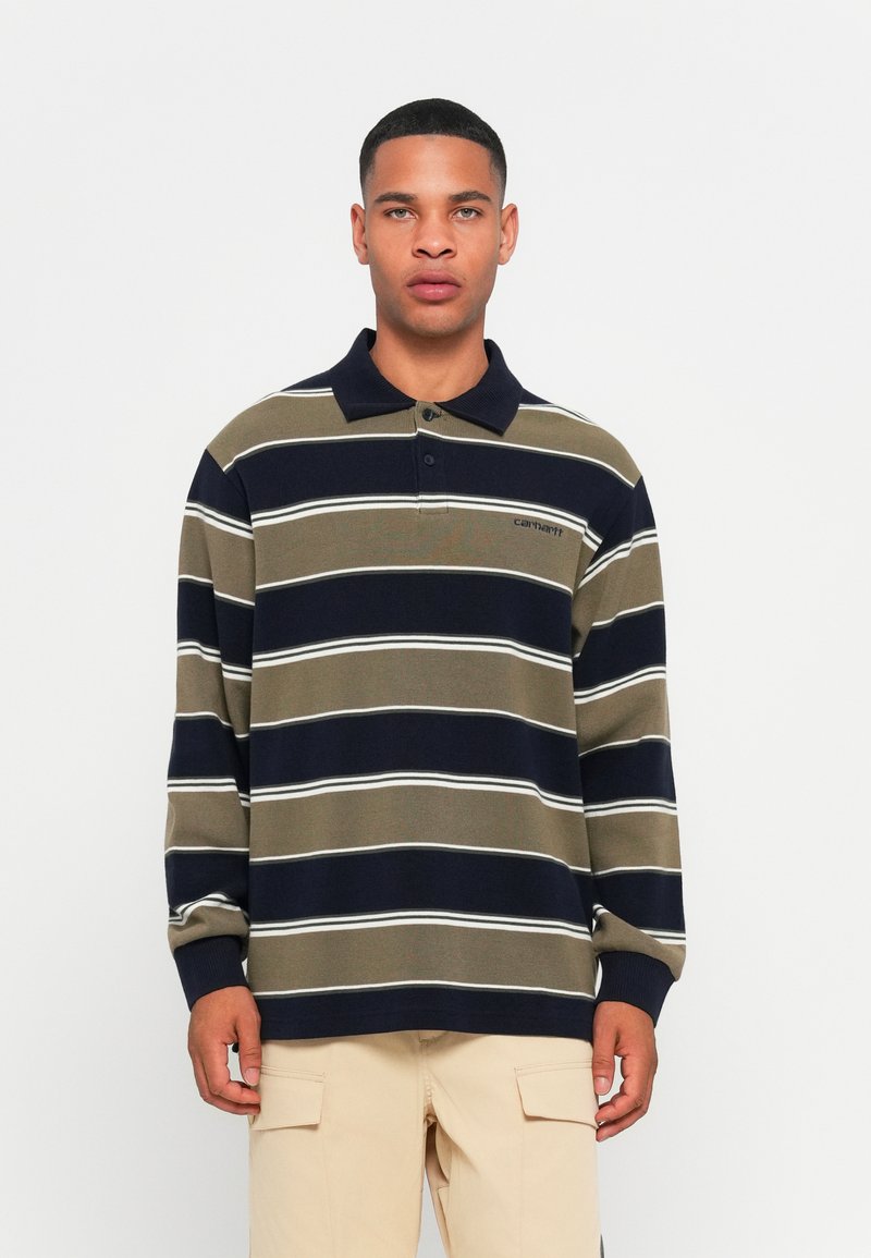 Poloshirt met lange mouwen in olijfgroen en marineblauwe strepen met witte accenten. Voorzien van een kraag en een sluiting met twee knopen, gewafelde manchetten.