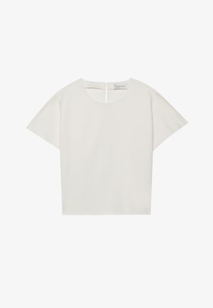 Kratke rokave, krema majica z čolnastim izrezom, z zadrgo na hrbtu in rahlo ohlapnim krojem. Tkanina ima gladko, mat površino.