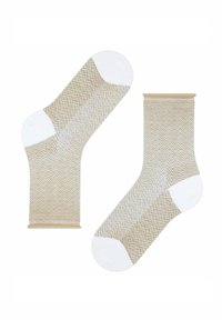 Beige Baumwollsocken mit Fischgrätmuster, weißen Akzenten an Spitzen und Fersen sowie elastischen Bündchen. Weicher Textil, Knielänge.