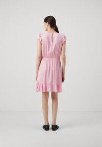 Pink, short-sleeved dress featuring an elastic waist and ruffled hem. Back keyhole closure adds detail to the simple design.