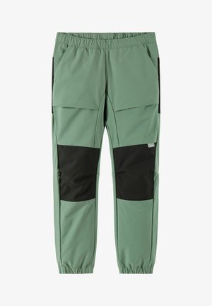 Light green, elastic-waist pants featuring black panels, front pockets, a smooth texture, and a tapered leg design.