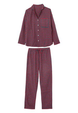 Set di pigiama a quadri rossi e verdi con camicia a maniche lunghe con bottoni e taschino sul petto e pantaloni con vita elastica e coulisse. Tessuto in cotone.