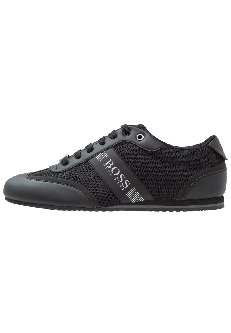 Black athletic shoe featuring a mix of smooth synthetic leather and breathable fabric, with a logo accent and traditional lace-up design.
