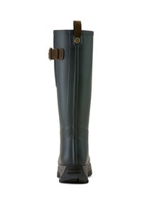 Tall, dark green rubber boot with a textured surface, brown strap and buckle accent, and a rugged black sole featuring the word “ARIAT.”