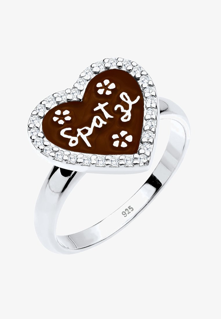 Herzförmiger Silberring mit braunem Emaille-Mittelteil, verziert mit weißen Blumenmustern und der Inschrift "Spatzl", umgeben von kleinen klaren Steinen.
