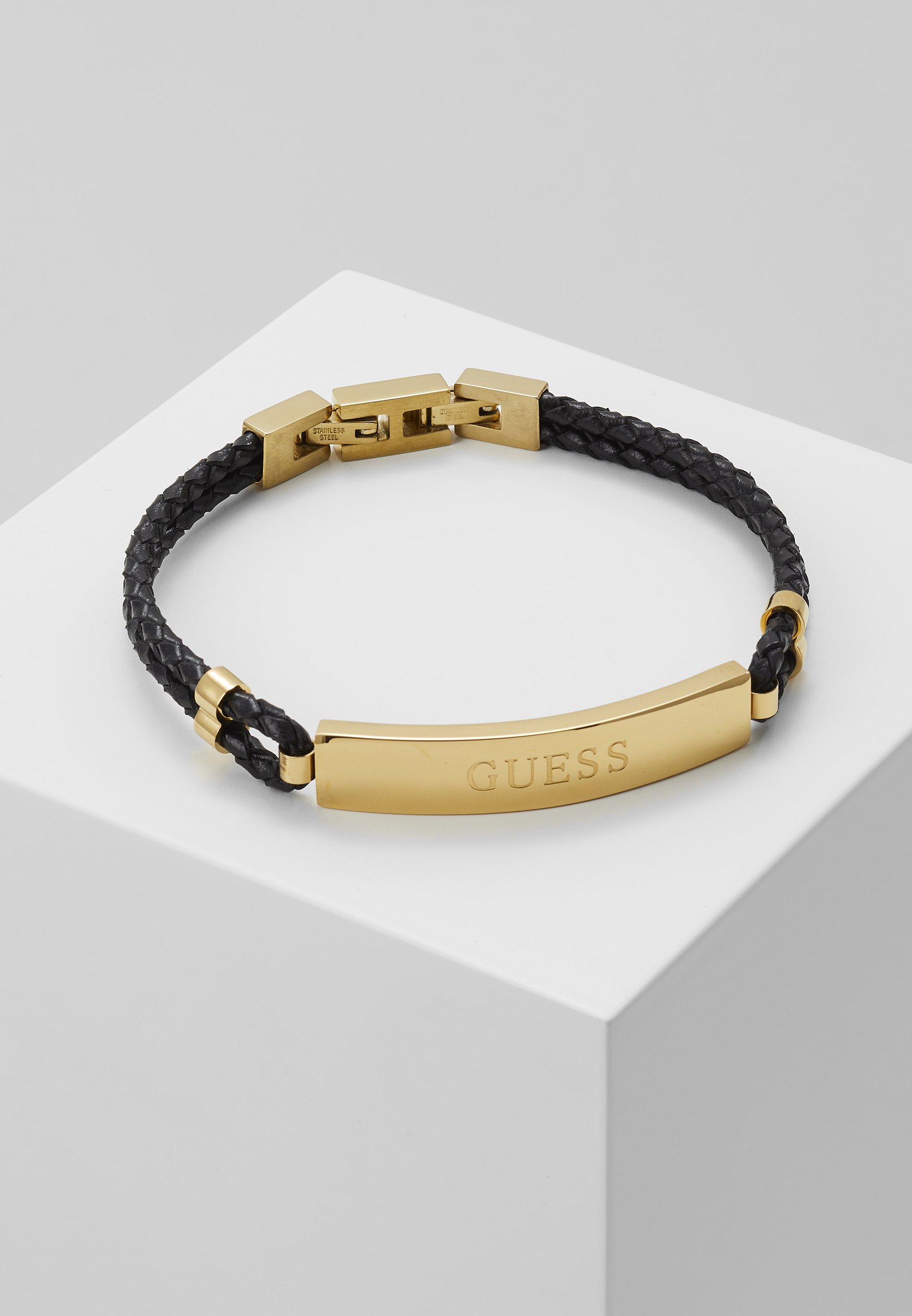 guess gold bangle